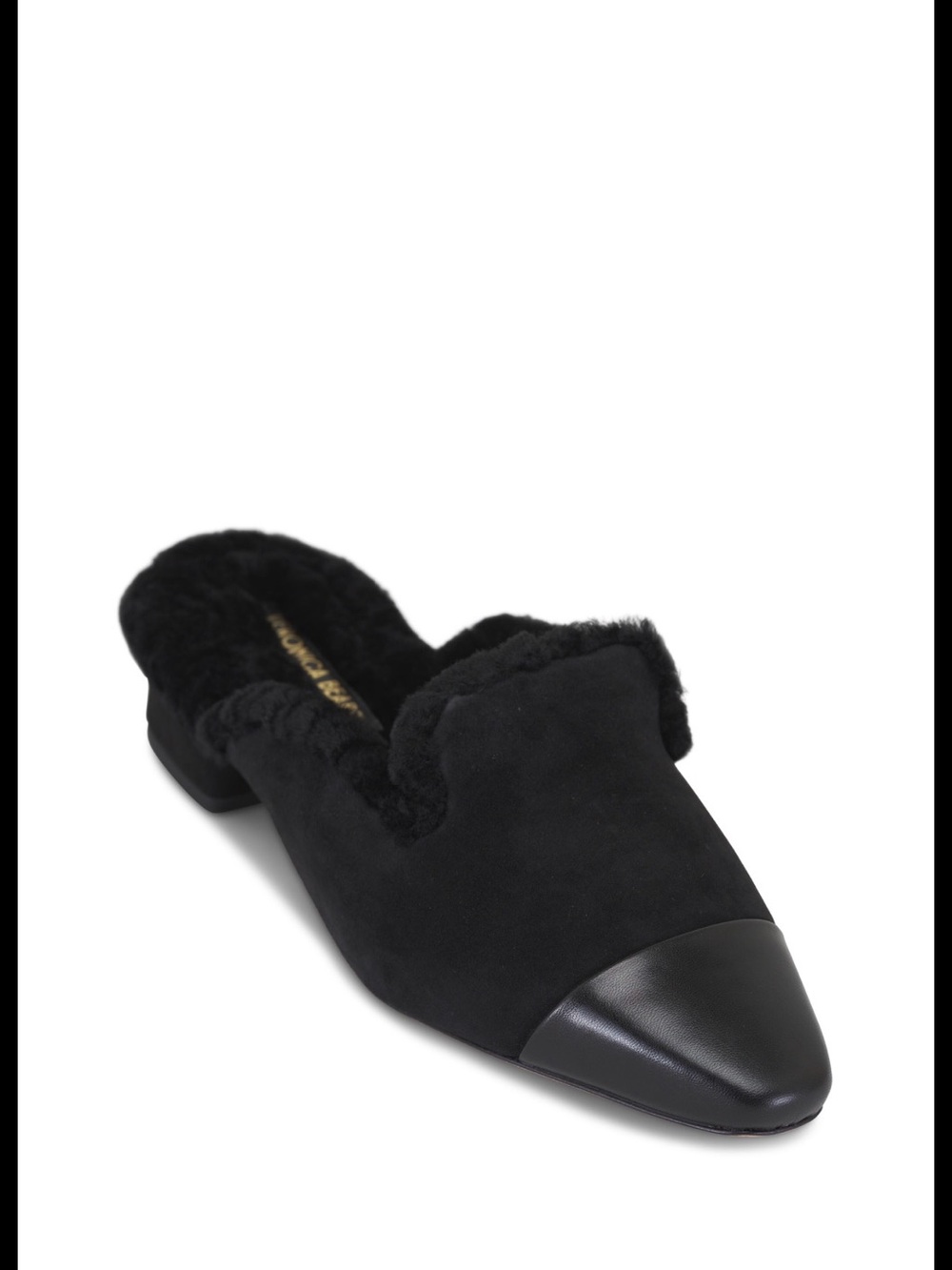 black suede mules with shearling trim and leather detailing